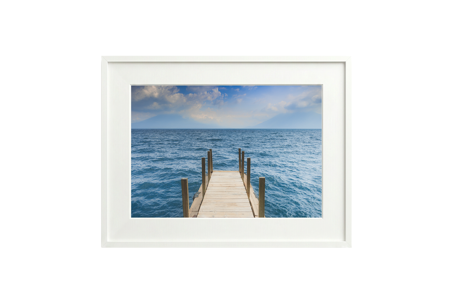 Framed artwork of a wooden dock extending into the ocean with a white frame.
