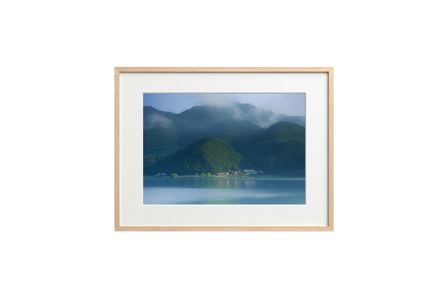 Framed photograph of a mountain landscape with a lake.
