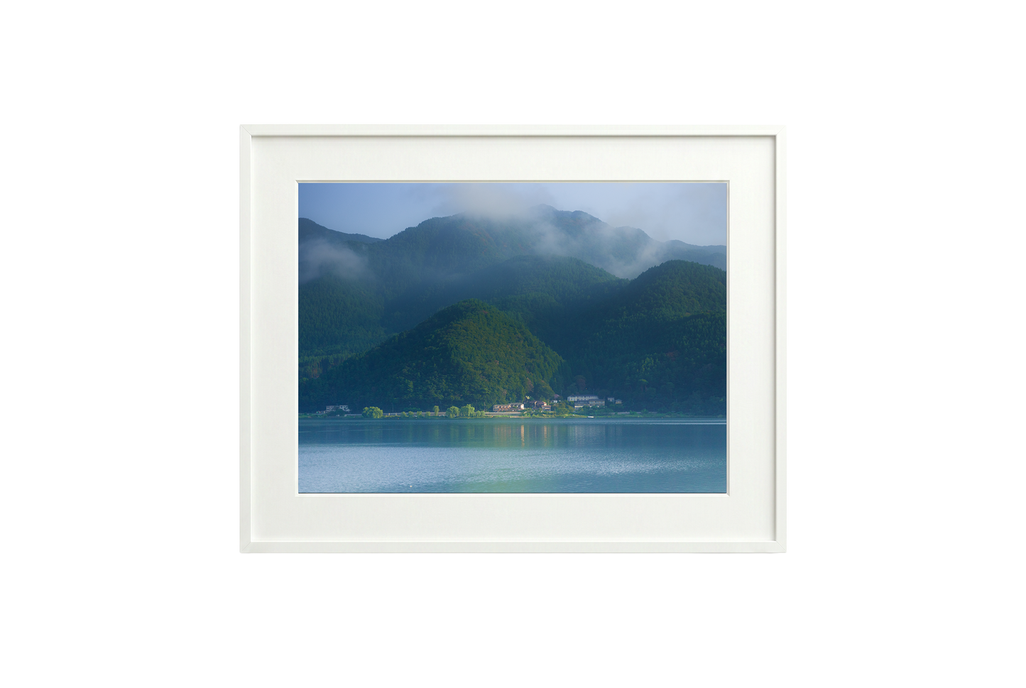 Framed photograph of a mountain landscape with a lake.
