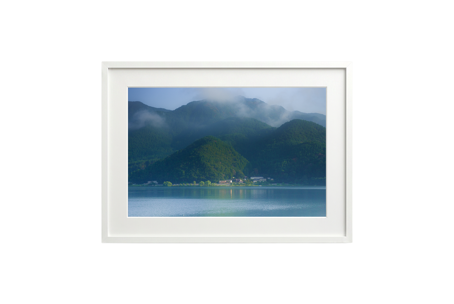 Framed photograph of a mountain landscape with a lake.