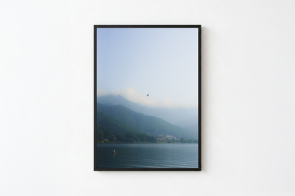 minimalist mountain lake photography print features a serene blue-toned landscape