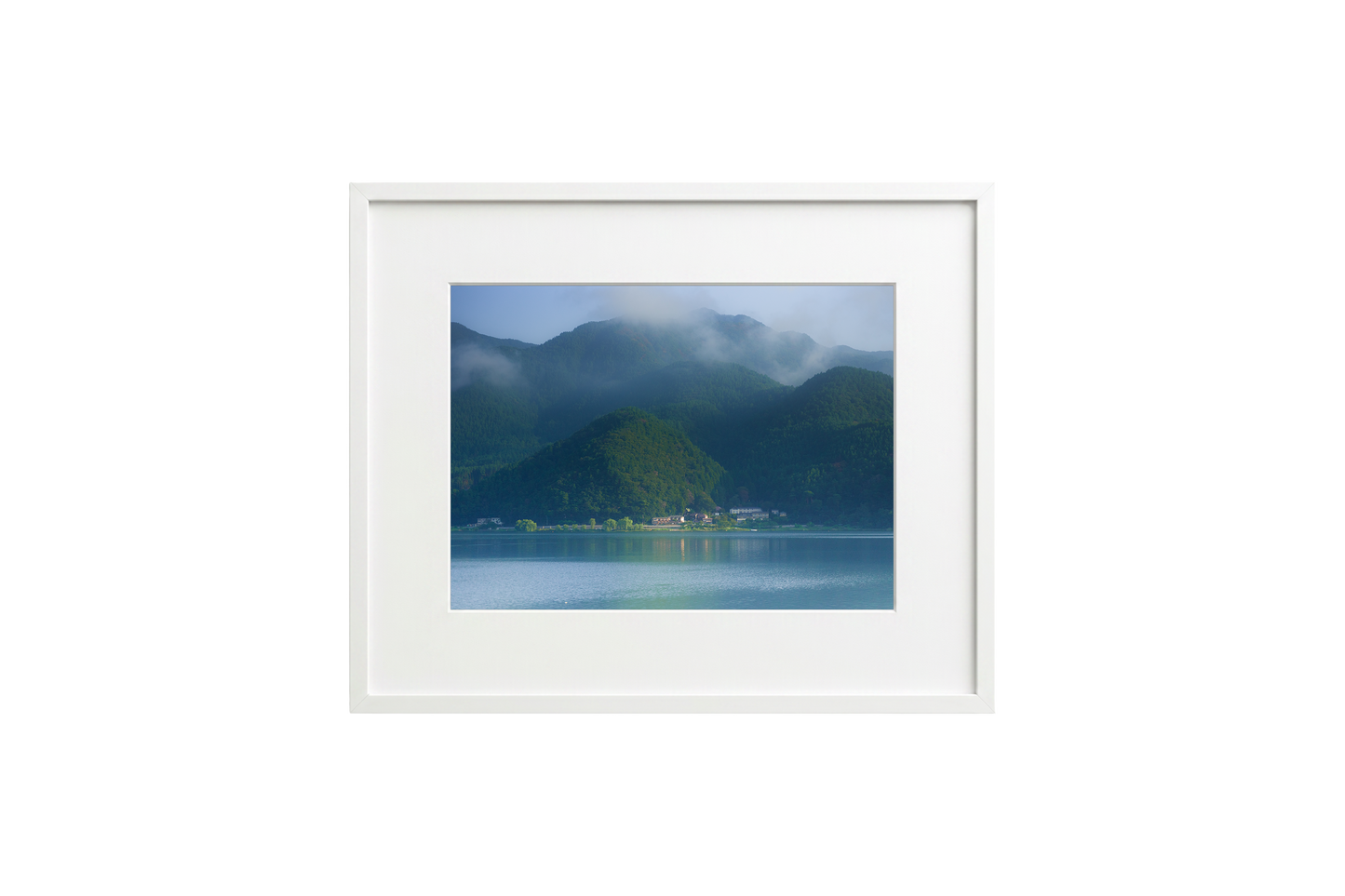 Framed photograph of a mountain landscape with a lake.