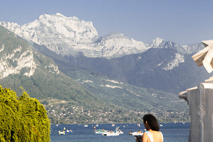 This alpine lake wall art print features serene blue tones, mountain landscapes, and a peaceful waterside setting, making it ideal for minimalist and modern interiors. Inspired by European lakeside scenery, this fine art photography print brings calm, light, and openness into your home. Perfect for those seeking tranquil wall art, mountain lake decor, or serene nature photography for living rooms and bedrooms