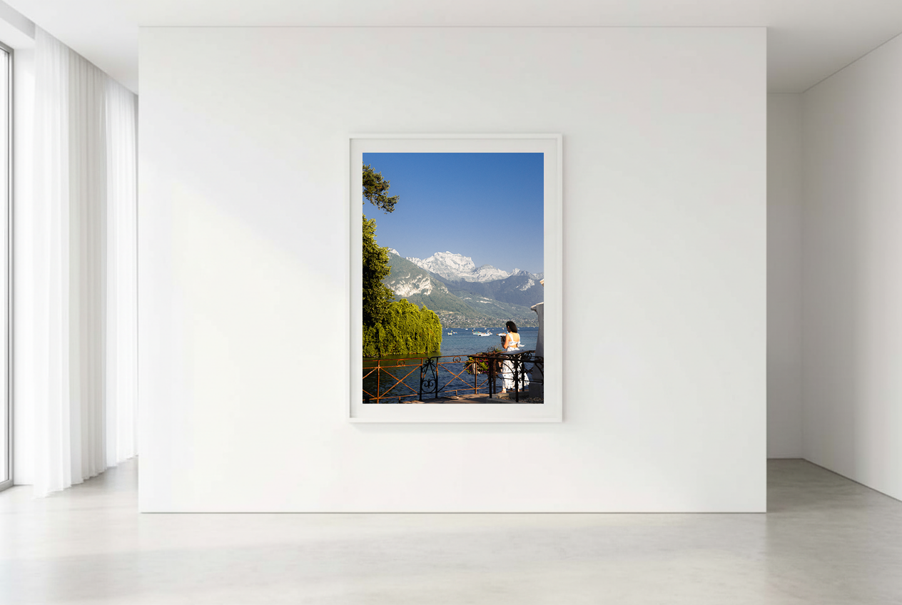 This alpine lake wall art print features serene blue tones, mountain landscapes, and a peaceful waterside setting, making it ideal for minimalist and modern interiors. Inspired by European lakeside scenery, this fine art photography print brings calm, light, and openness into your home. Perfect for those seeking tranquil wall art, mountain lake decor, or serene nature photography for living rooms and bedrooms