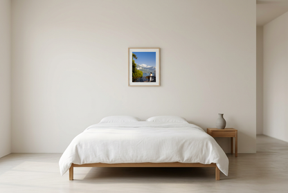 This alpine lake wall art print features serene blue tones, mountain landscapes, and a peaceful waterside setting, making it ideal for minimalist and modern interiors. Inspired by European lakeside scenery, this fine art photography print brings calm, light, and openness into your home. Perfect for those seeking tranquil wall art, mountain lake decor, or serene nature photography for living rooms and bedrooms