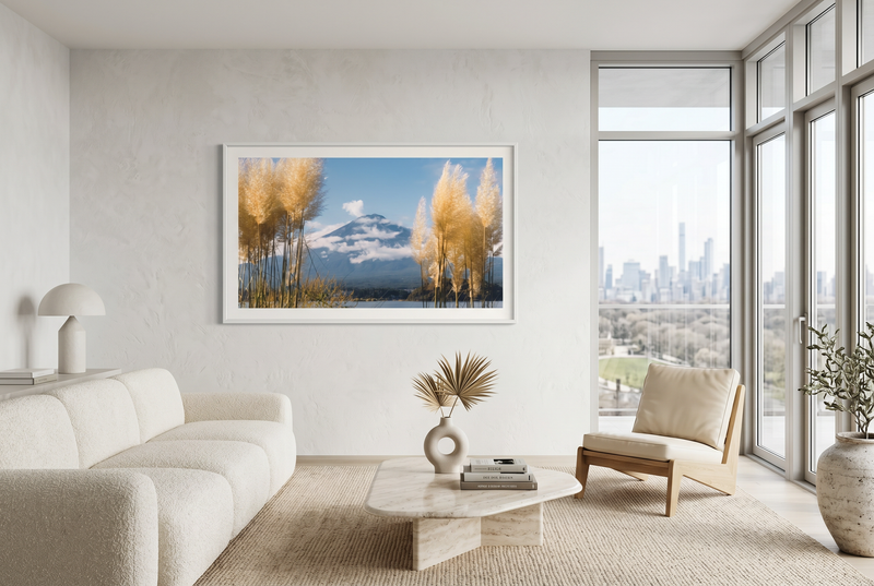 Modern living room with a large window view, white sofa, and decorative Mt Fuji Fine Art Photography on the wall.