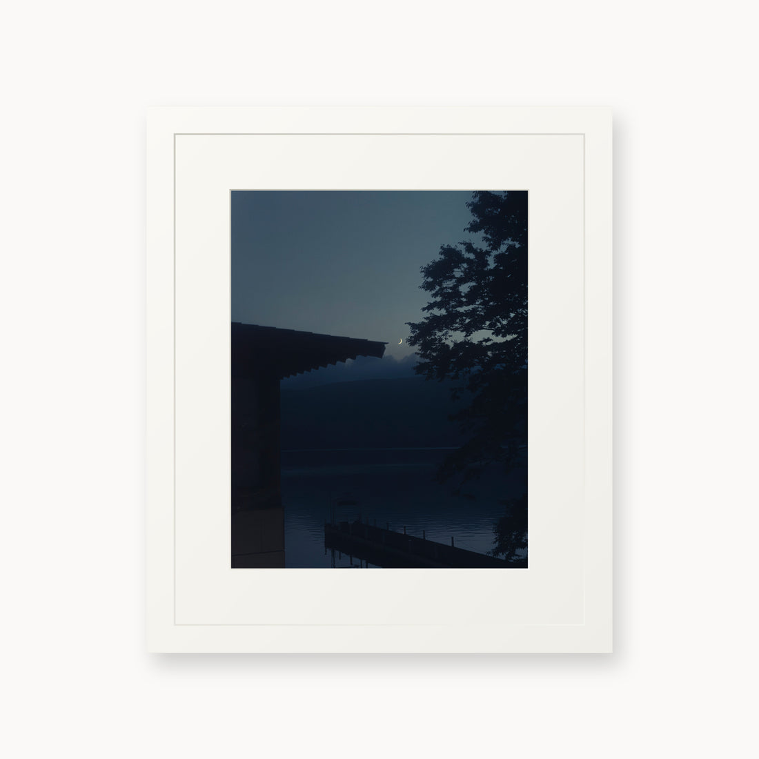 
A Daimyo’s Night — 11x14, white frame. Moon beside a dark roofline and leafy branches reflected in still water.