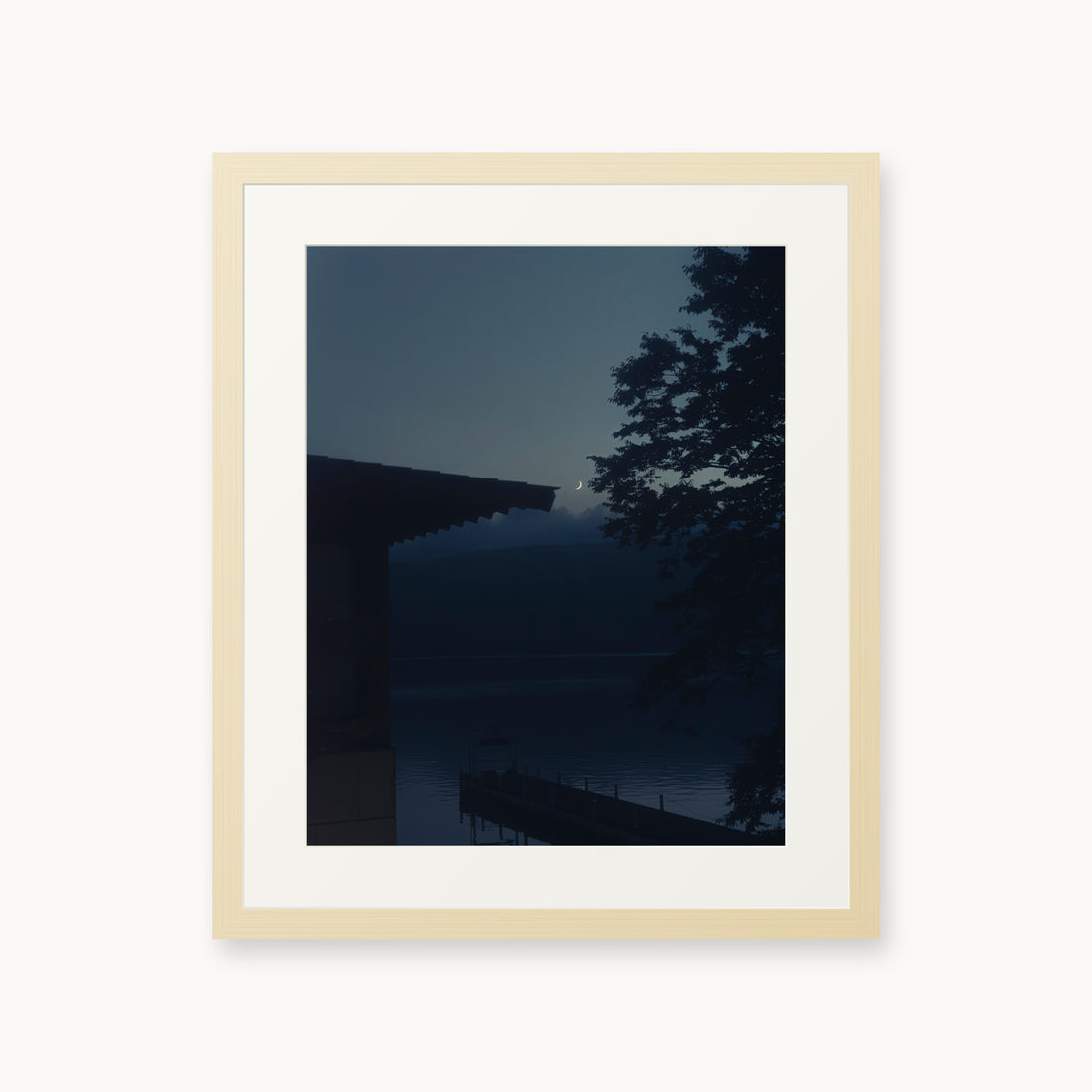 
A Daimyo’s Night — 16x20, maple frame. Moon beside a dark roofline and leafy branches reflected in still water.