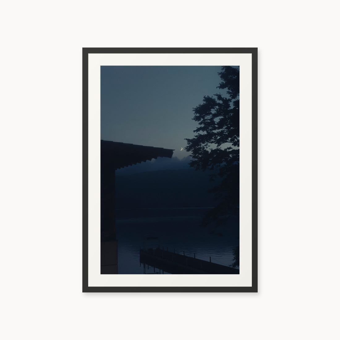 
A Daimyo’s Night — 24x36, black frame. Moon beside a dark roofline and leafy branches reflected in still water.