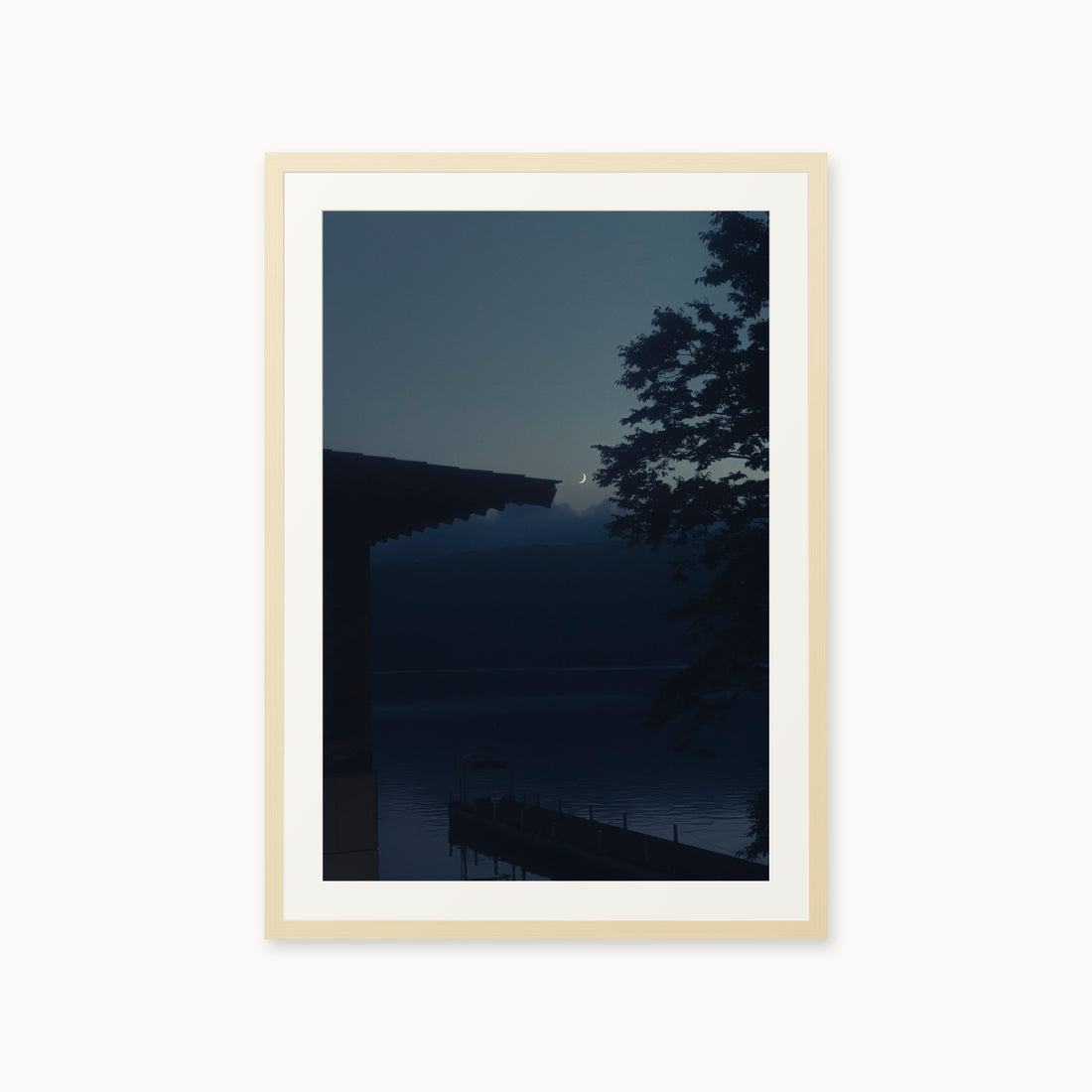
A Daimyo’s Night — 24x36, maple frame. Moon beside a dark roofline and leafy branches reflected in still water.