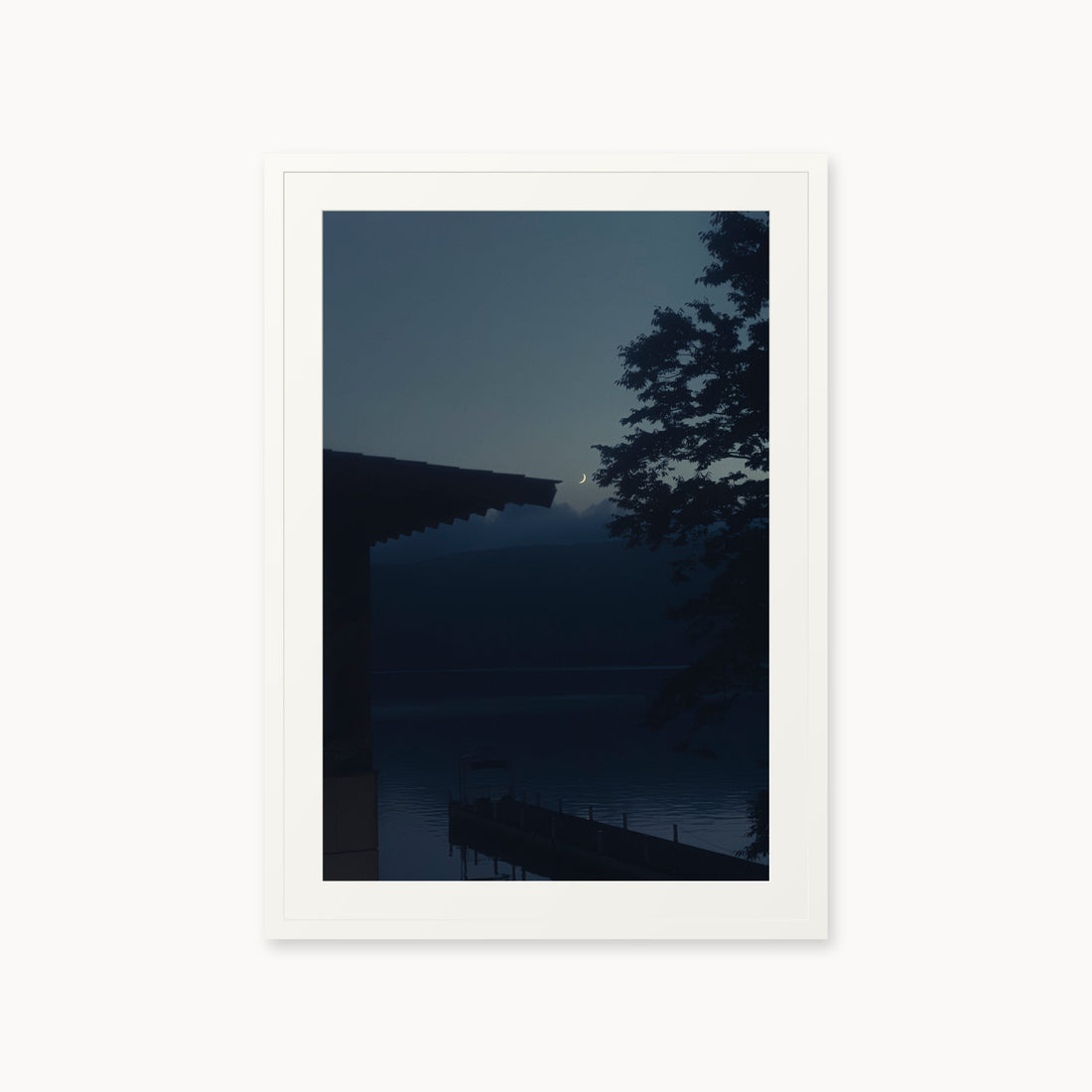 
A Daimyo’s Night — 24x36, white frame. Moon beside a dark roofline and leafy branches reflected in still water.