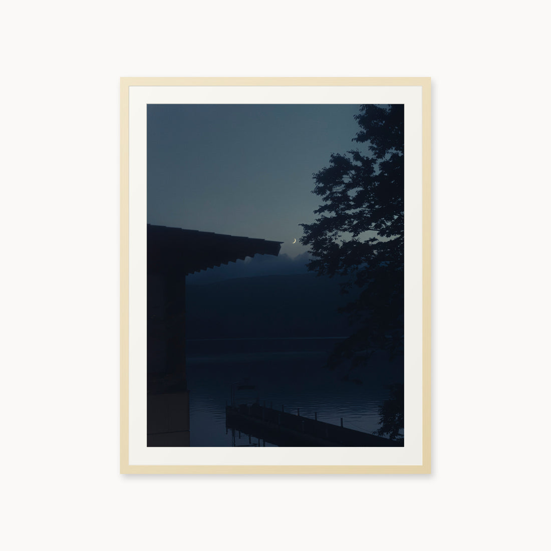
A Daimyo’s Night — 30x40, maple frame. Moon beside a dark roofline and leafy branches reflected in still water.