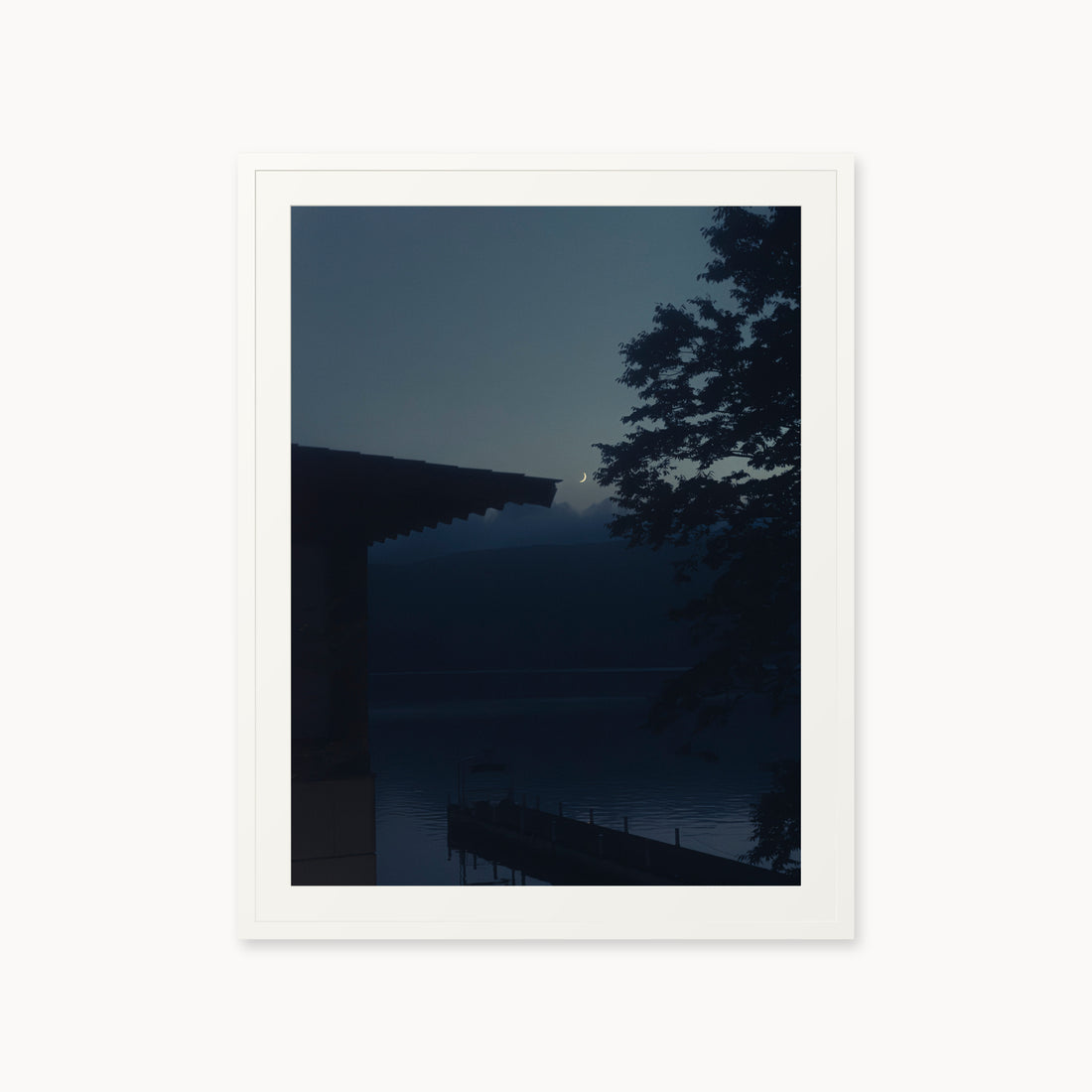 
A Daimyo’s Night — 30x40, white frame. Moon beside a dark roofline and leafy branches reflected in still water.