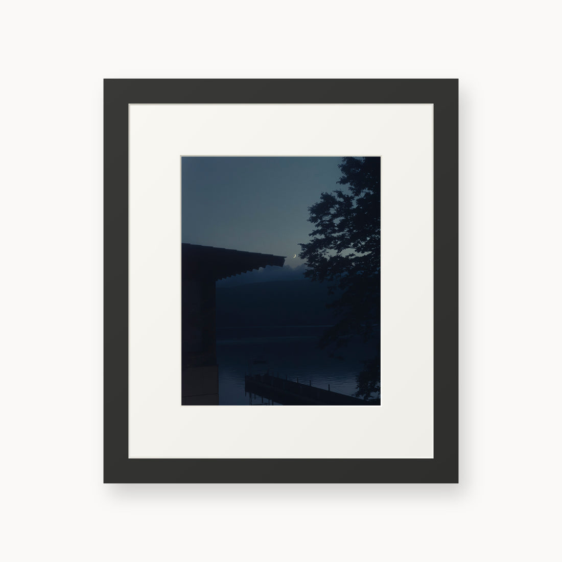 
A Daimyo’s Night — 8x10, black frame. Moon beside a dark roofline and leafy branches reflected in still water.
