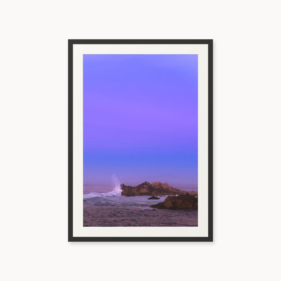 
Bonbon Beach — 24x36, black frame. A breaking wave and rocky shoreline beneath a broad violet sky.