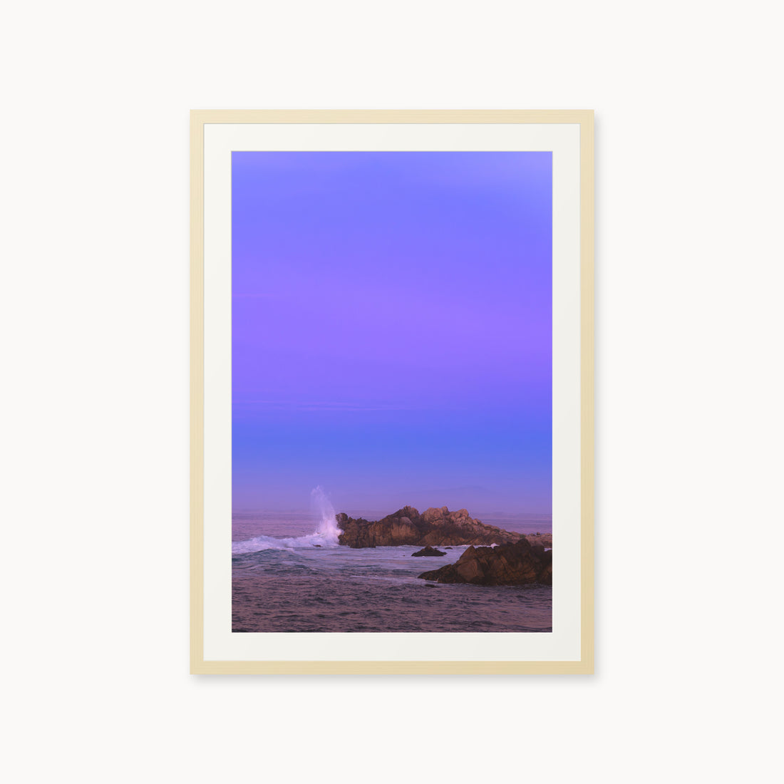 
Bonbon Beach — 24x36, maple frame. A breaking wave and rocky shoreline beneath a broad violet sky.