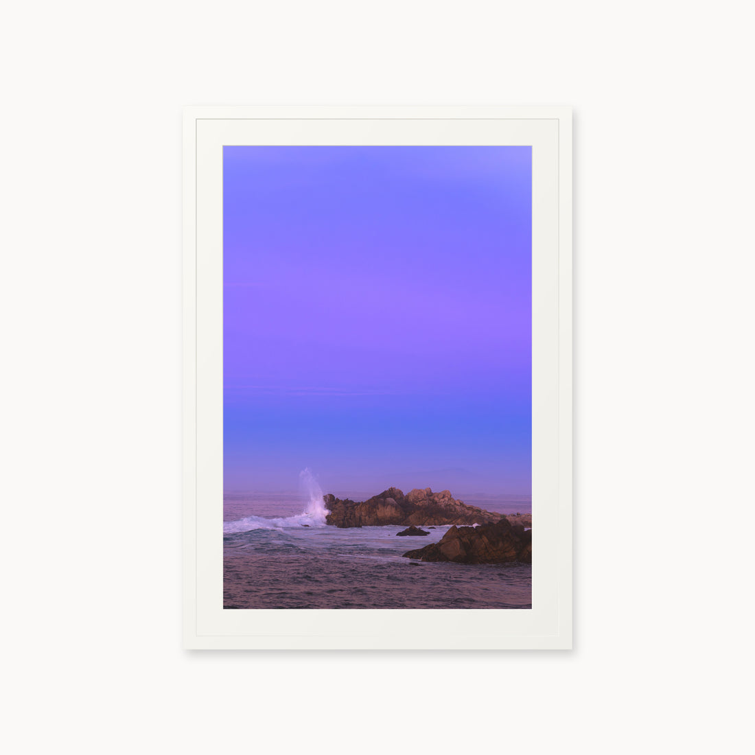 
Bonbon Beach — 24x36, white frame. A breaking wave and rocky shoreline beneath a broad violet sky.