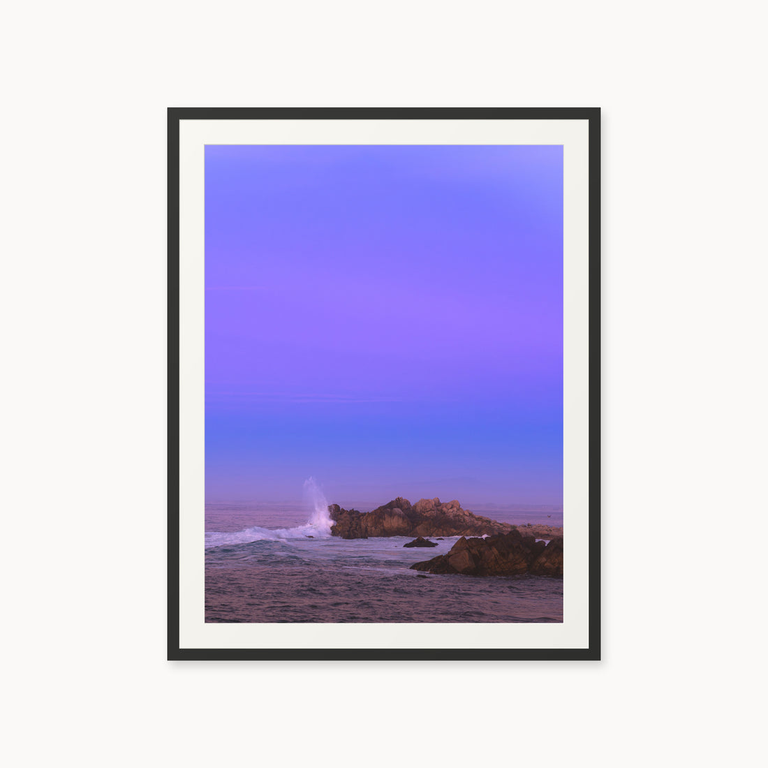
Bonbon Beach — 30x40, black frame. A breaking wave and rocky shoreline beneath a broad violet sky.