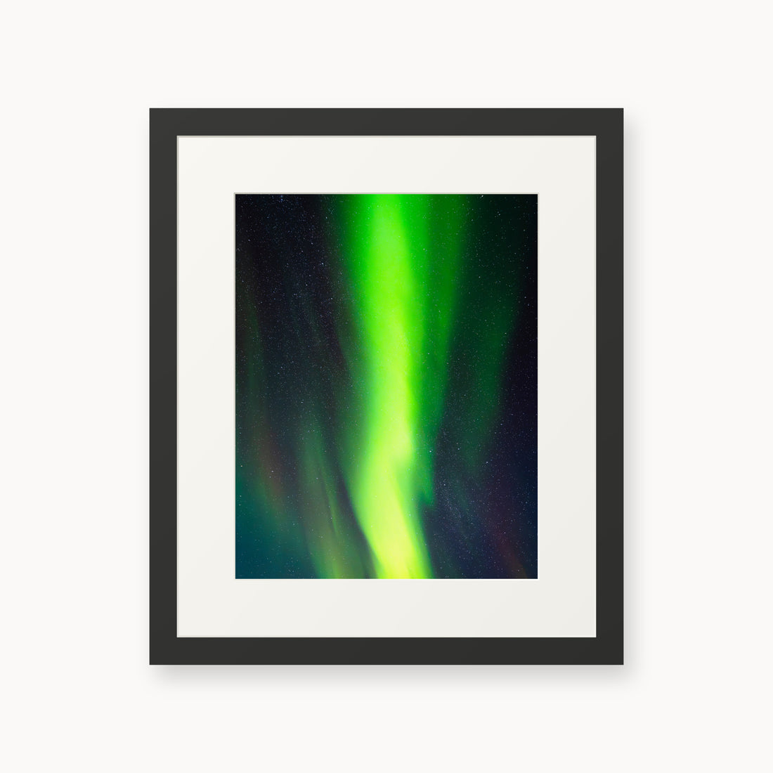 
Cosmic Curtain — 11x14, black frame. A vivid green aurora crossing a star-filled night sky.