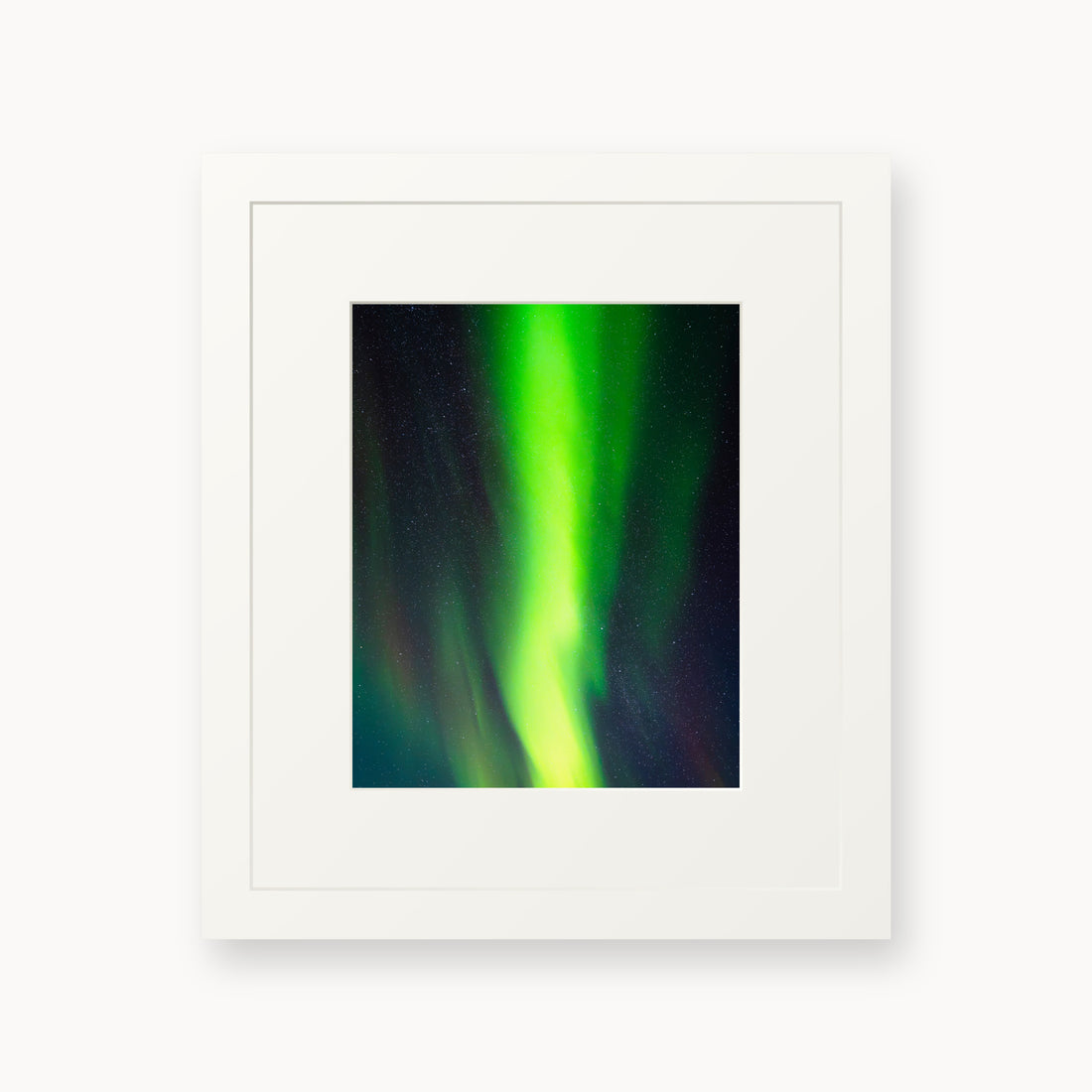 
Cosmic Curtain — 8x10, white frame. A vivid green aurora crossing a star-filled night sky.