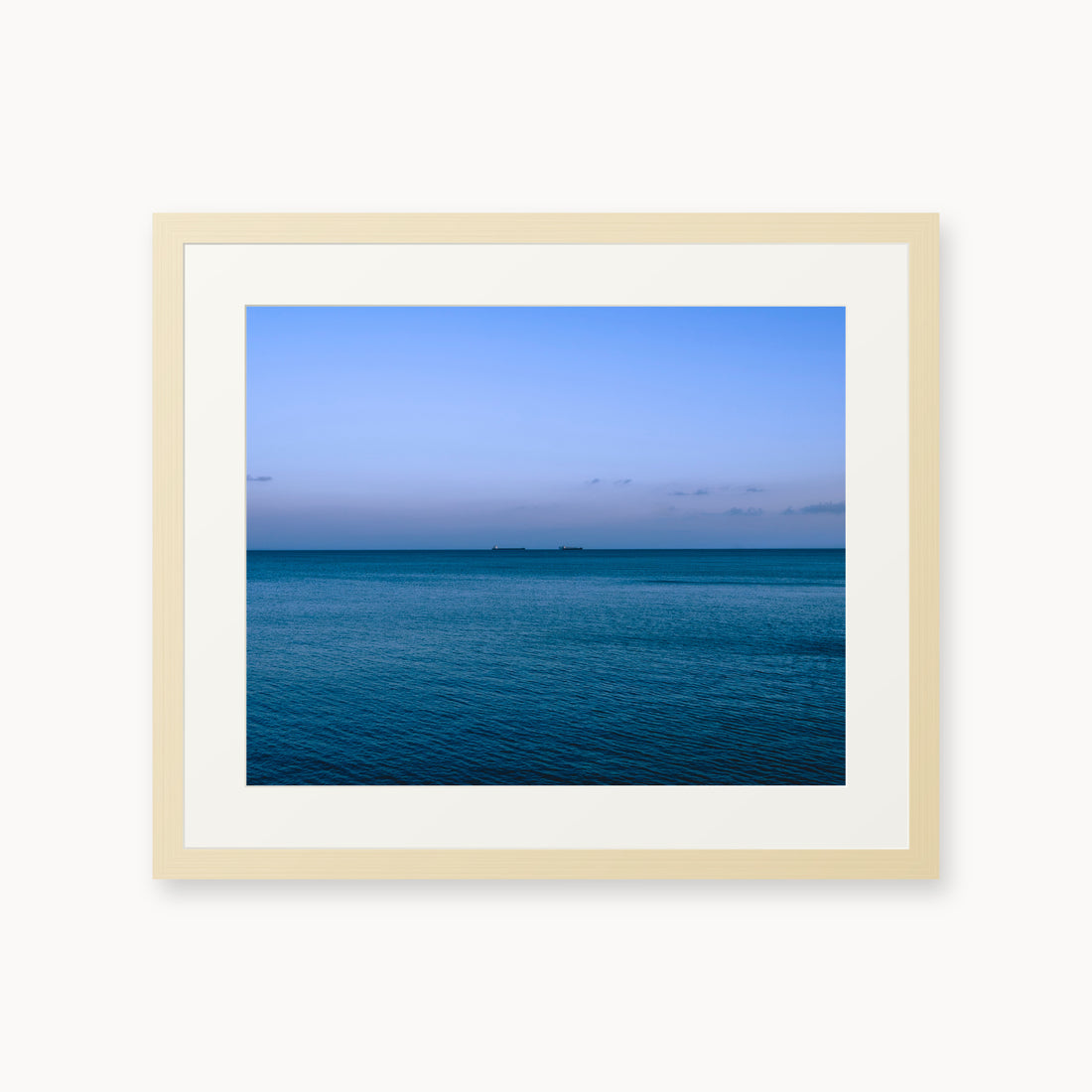 
Deux Bateaux Passants — 16x20, maple frame. Two distant vessels along the horizon above a calm blue sea.