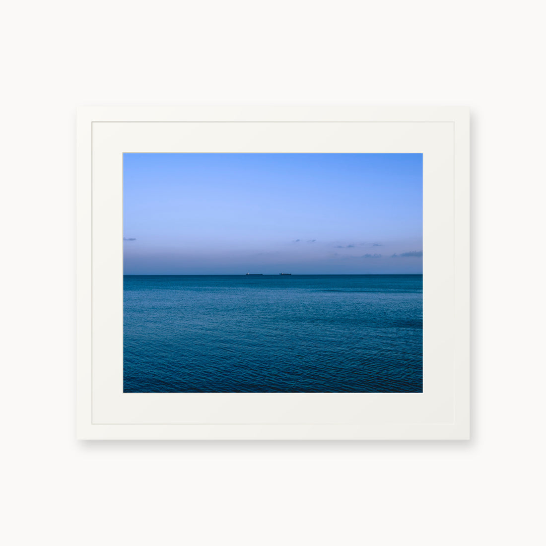 
Deux Bateaux Passants — 16x20, white frame. Two distant vessels along the horizon above a calm blue sea.