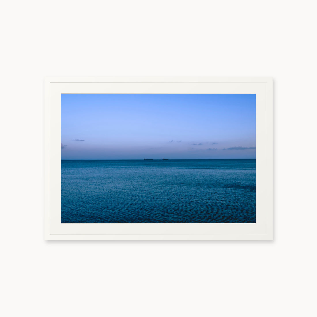 
Deux Bateaux Passants — 24x36, white frame. Two distant vessels along the horizon above a calm blue sea.