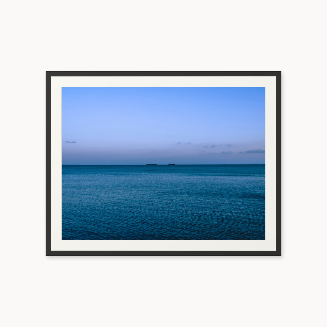 
Deux Bateaux Passants — 30x40, black frame. Two distant vessels along the horizon above a calm blue sea.