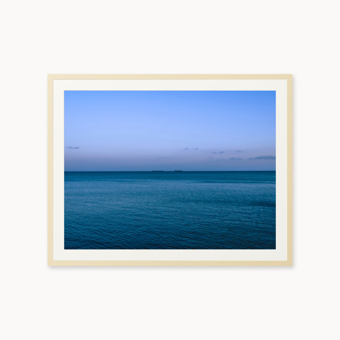
Deux Bateaux Passants — 30x40, maple frame. Two distant vessels along the horizon above a calm blue sea.