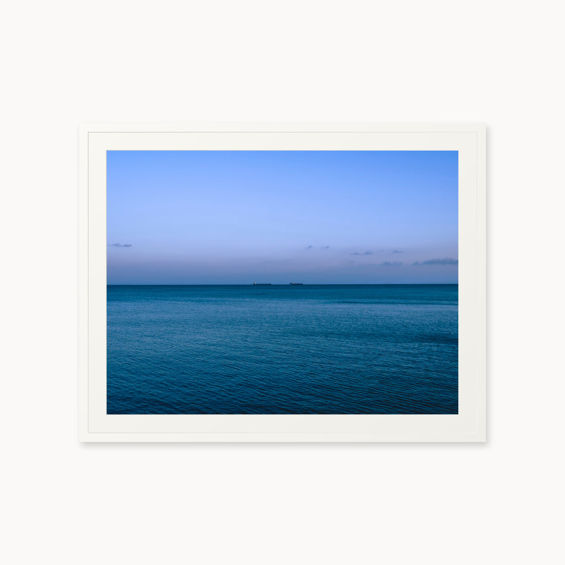 
Deux Bateaux Passants — 30x40, white frame. Two distant vessels along the horizon above a calm blue sea.