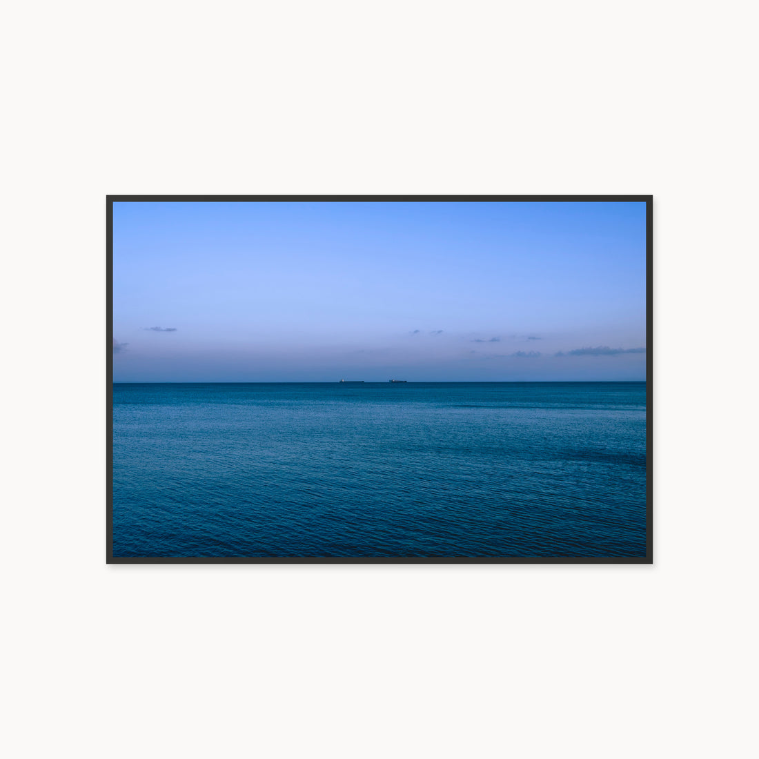 
Deux Bateaux Passants — 40x60, black frame. Two distant vessels along the horizon above a calm blue sea.