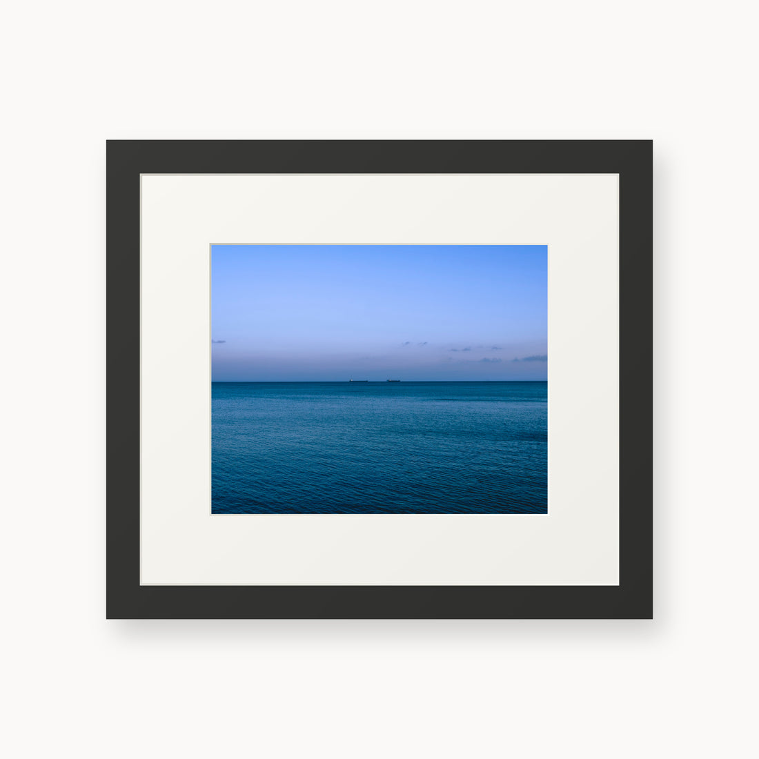 
Deux Bateaux Passants — 8x10, black frame. Two distant vessels along the horizon above a calm blue sea.