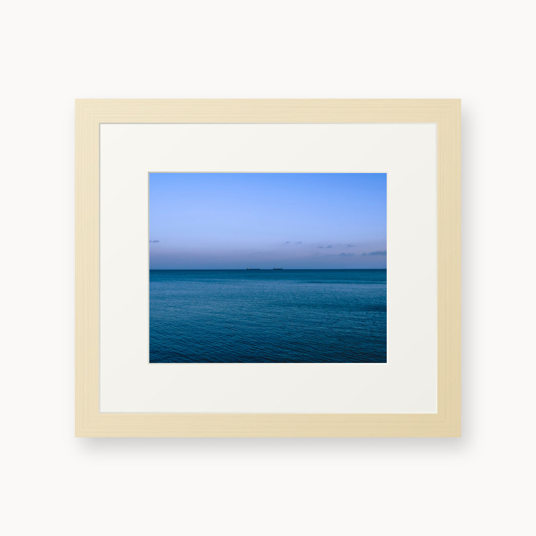 
Deux Bateaux Passants — 8x10, maple frame. Two distant vessels along the horizon above a calm blue sea.