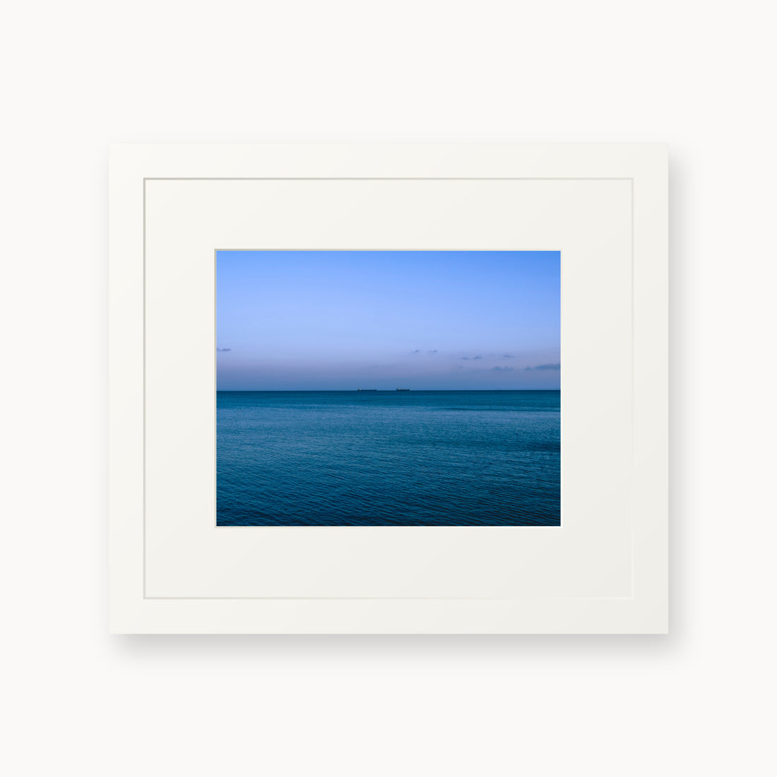 
Deux Bateaux Passants — 8x10, white frame. Two distant vessels along the horizon above a calm blue sea.