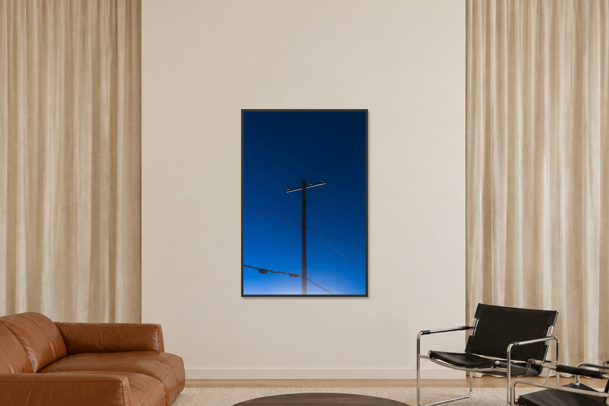 
Power fine art photograph in a 40×60 black frame in a sitting room.