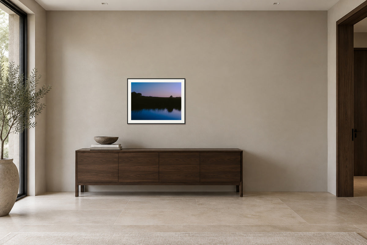 
What Lays Beneath fine art print, 30×40 in black frame, hallway mockup