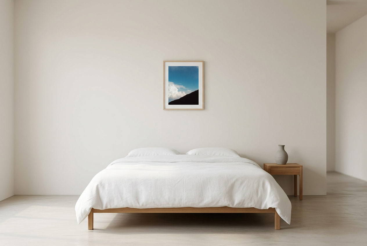 This minimalist mountain wall art features a blue sky landscape with a subtle human silhouette, creating a calm and reflective atmosphere. Perfect for modern and Scandinavian interiors, it adds depth and quiet elegance to any room.