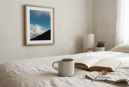 This minimalist mountain wall art features a blue sky landscape with a subtle human silhouette, creating a calm and reflective atmosphere. Perfect for modern and Scandinavian interiors, it adds depth and quiet elegance to any room.