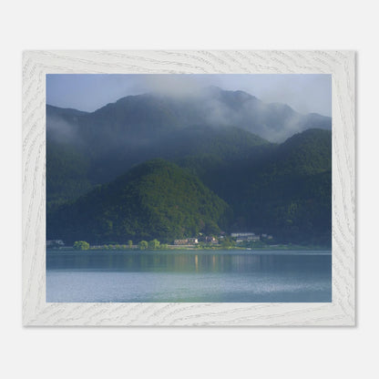This misty lake mountain landscape wall art print captures serene blue tones and tranquil natural scenery, making it ideal for minimalist home decor. Designed for calming interiors, this fine art nature photography print enhances spaces with peaceful lake reflections, foggy mountain layers, and soft atmospheric light. A perfect choice for those seeking calming wall art, nature-inspired decor, or serene landscape prints for modern homes.