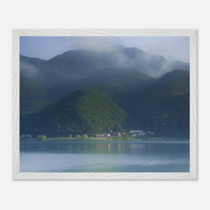 This misty lake mountain landscape wall art print captures serene blue tones and tranquil natural scenery, making it ideal for minimalist home decor. Designed for calming interiors, this fine art nature photography print enhances spaces with peaceful lake reflections, foggy mountain layers, and soft atmospheric light. A perfect choice for those seeking calming wall art, nature-inspired decor, or serene landscape prints for modern homes.