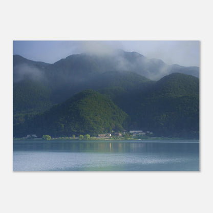 This misty lake mountain landscape wall art print captures serene blue tones and tranquil natural scenery, making it ideal for minimalist home decor. Designed for calming interiors, this fine art nature photography print enhances spaces with peaceful lake reflections, foggy mountain layers, and soft atmospheric light. A perfect choice for those seeking calming wall art, nature-inspired decor, or serene landscape prints for modern homes.