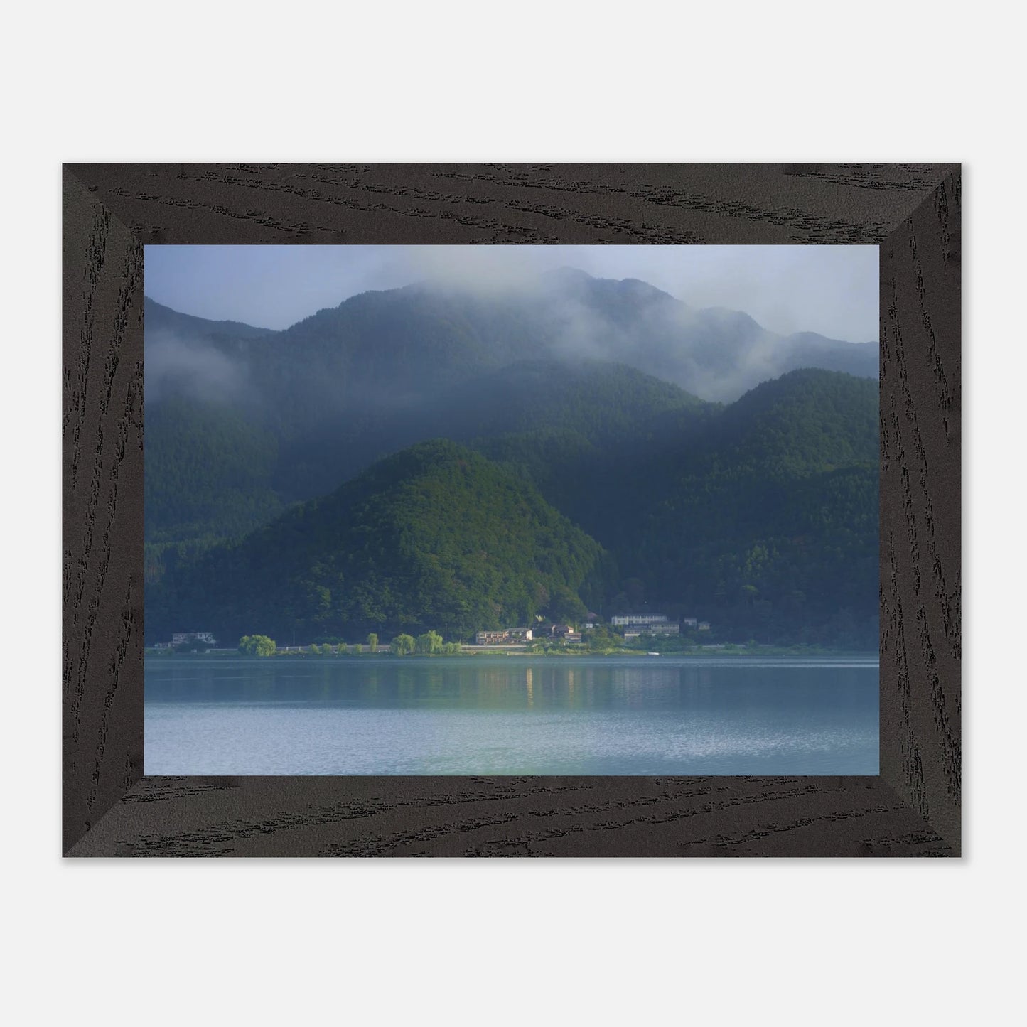 This misty lake mountain landscape wall art print captures serene blue tones and tranquil natural scenery, making it ideal for minimalist home decor. Designed for calming interiors, this fine art nature photography print enhances spaces with peaceful lake reflections, foggy mountain layers, and soft atmospheric light. A perfect choice for those seeking calming wall art, nature-inspired decor, or serene landscape prints for modern homes.