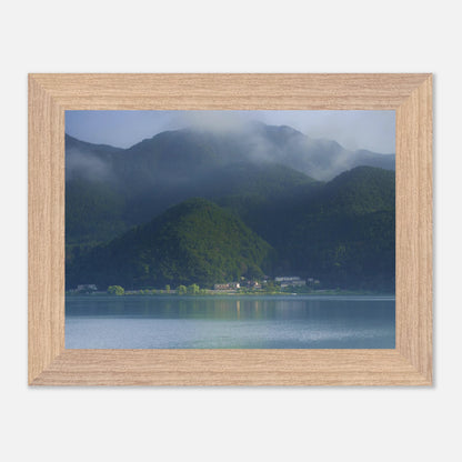 This misty lake mountain landscape wall art print captures serene blue tones and tranquil natural scenery, making it ideal for minimalist home decor. Designed for calming interiors, this fine art nature photography print enhances spaces with peaceful lake reflections, foggy mountain layers, and soft atmospheric light. A perfect choice for those seeking calming wall art, nature-inspired decor, or serene landscape prints for modern homes.