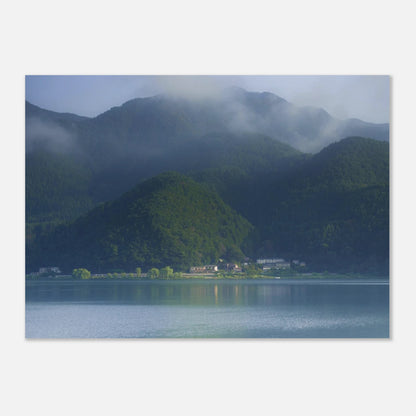 This misty lake mountain landscape wall art print captures serene blue tones and tranquil natural scenery, making it ideal for minimalist home decor. Designed for calming interiors, this fine art nature photography print enhances spaces with peaceful lake reflections, foggy mountain layers, and soft atmospheric light. A perfect choice for those seeking calming wall art, nature-inspired decor, or serene landscape prints for modern homes.
