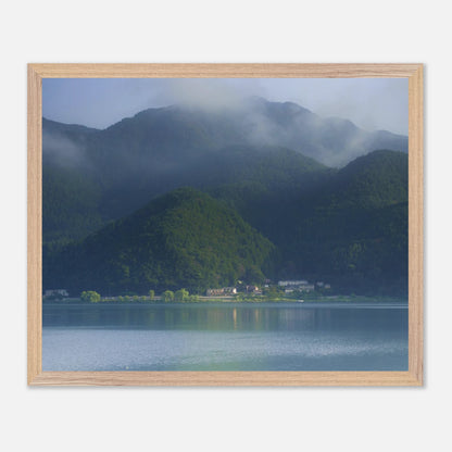 This misty lake mountain landscape wall art print captures serene blue tones and tranquil natural scenery, making it ideal for minimalist home decor. Designed for calming interiors, this fine art nature photography print enhances spaces with peaceful lake reflections, foggy mountain layers, and soft atmospheric light. A perfect choice for those seeking calming wall art, nature-inspired decor, or serene landscape prints for modern homes.
