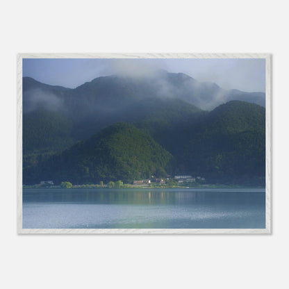 This misty lake mountain landscape wall art print captures serene blue tones and tranquil natural scenery, making it ideal for minimalist home decor. Designed for calming interiors, this fine art nature photography print enhances spaces with peaceful lake reflections, foggy mountain layers, and soft atmospheric light. A perfect choice for those seeking calming wall art, nature-inspired decor, or serene landscape prints for modern homes.