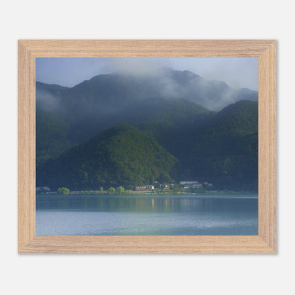 This misty lake mountain landscape wall art print captures serene blue tones and tranquil natural scenery, making it ideal for minimalist home decor. Designed for calming interiors, this fine art nature photography print enhances spaces with peaceful lake reflections, foggy mountain layers, and soft atmospheric light. A perfect choice for those seeking calming wall art, nature-inspired decor, or serene landscape prints for modern homes.