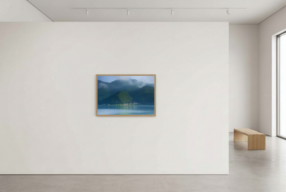 This misty lake mountain landscape wall art print captures serene blue tones and tranquil natural scenery, making it ideal for minimalist home decor. Designed for calming interiors, this fine art nature photography print enhances spaces with peaceful lake reflections, foggy mountain layers, and soft atmospheric light. A perfect choice for those seeking calming wall art, nature-inspired decor, or serene landscape prints for modern homes.