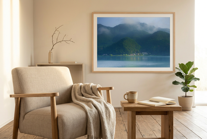 This misty lake mountain landscape wall art print captures serene blue tones and tranquil natural scenery, making it ideal for minimalist home decor. Designed for calming interiors, this fine art nature photography print enhances spaces with peaceful lake reflections, foggy mountain layers, and soft atmospheric light. A perfect choice for those seeking calming wall art, nature-inspired decor, or serene landscape prints for modern homes.