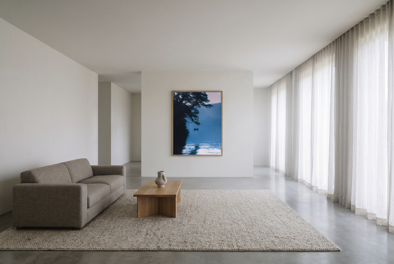 This minimalist lake photography print features a serene blue-toned landscape with a boat silhouette, making it perfect for calm wall art, Japandi decor, and modern minimalist interiors. Ideal for bedrooms, living rooms, and offices, this premium fine art print brings a peaceful, reflective atmosphere through soft blue hues and natural composition.